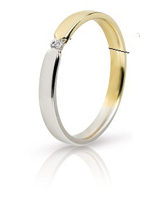 Wedding ring made of yellow and white gold 3mm on a polished surface with white zircon.