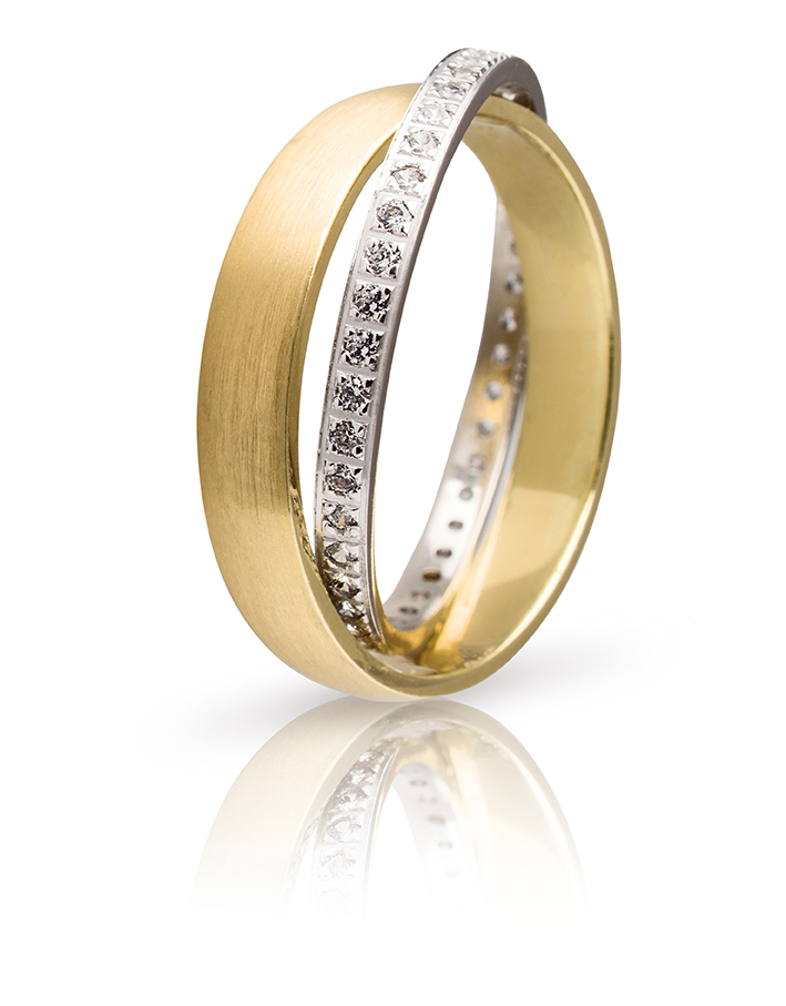 Double wedding ring made of yellow and white gold with white zircons.
