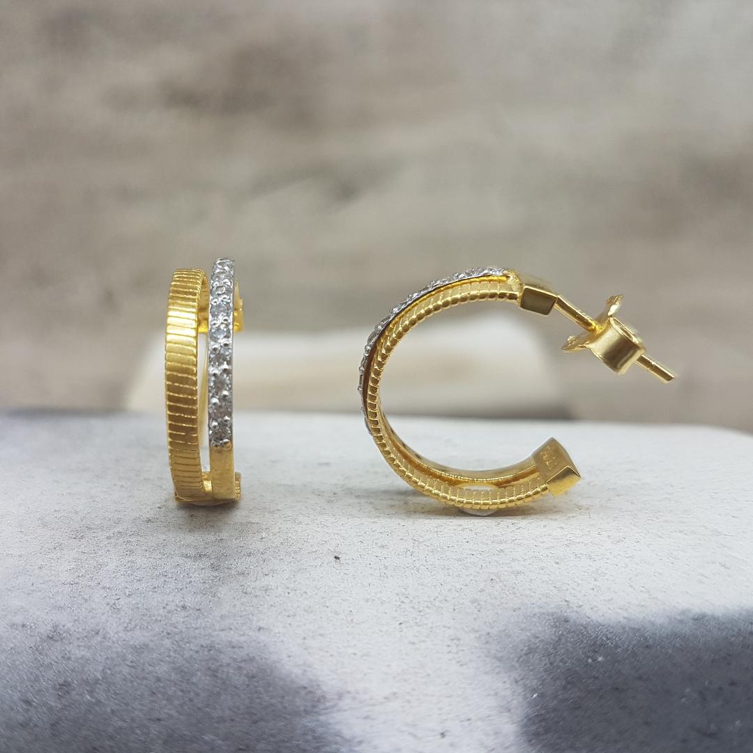 Womens handmade gold earrings K14 in the shape of a ring decorated with white zircons.