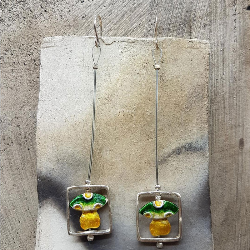Womens handmade earrings made of 925 ° silver decorated with green and yellow enamel.