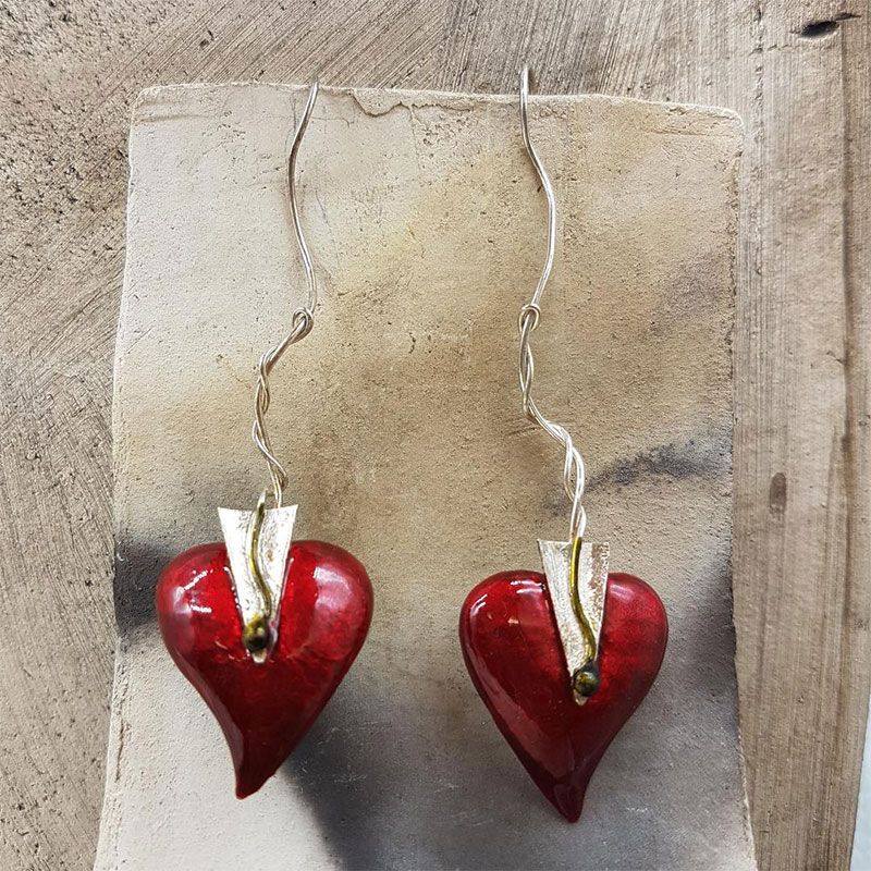 Womens handmade earrings made of 925 ° silver in the shape of a heart with red enamel.