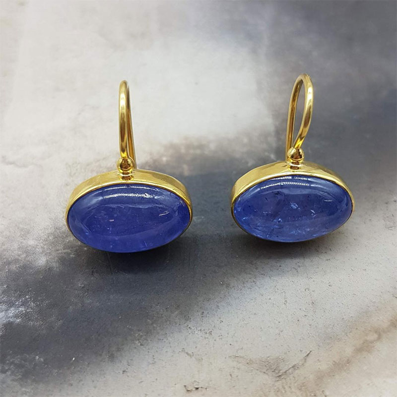Womens handmade earrings with hook made of K18 gold with natural blue Brazilian Tanzanite.