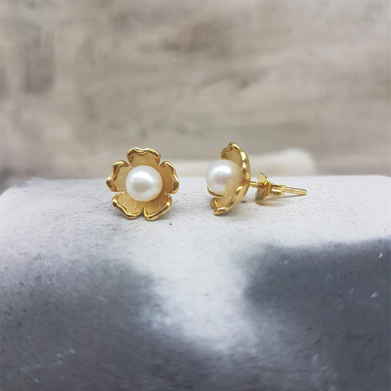 Womens handmade gold earrings K14 decorated with natural white pearls.