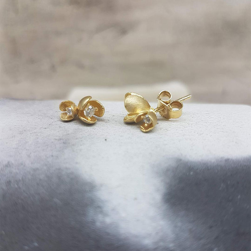 Womens handmade gold earrings K14 in the shape of a double flower decorated with white zircons.