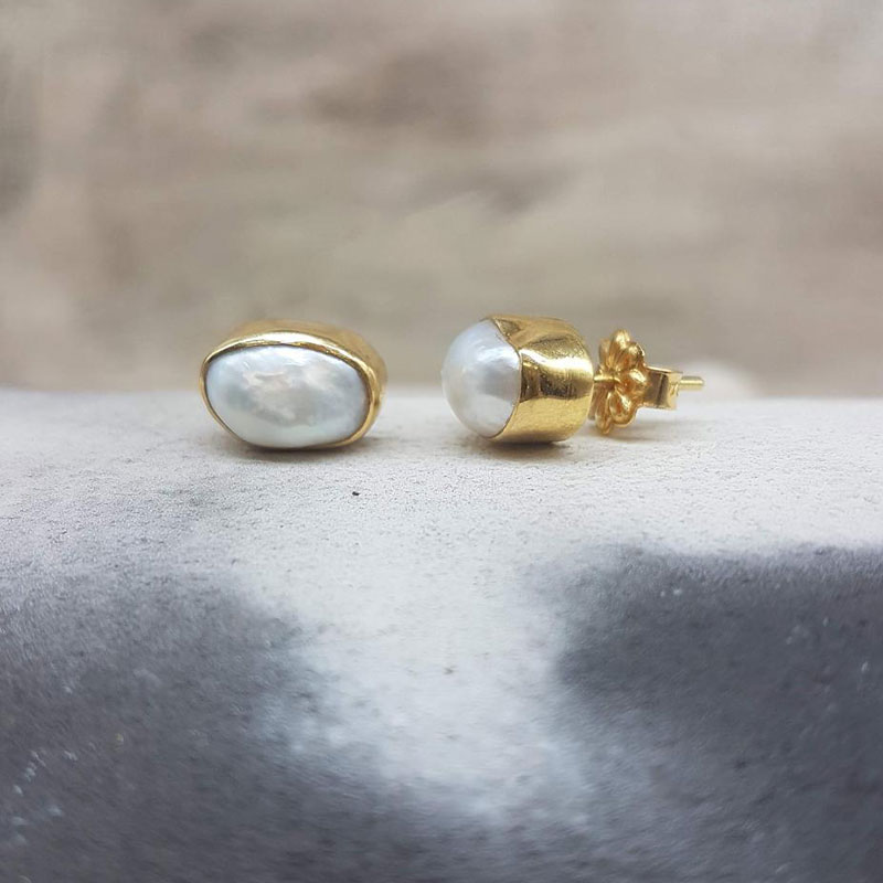 Womens handmade gold earrings K18 decorated with white natural pearls in baroque shape.