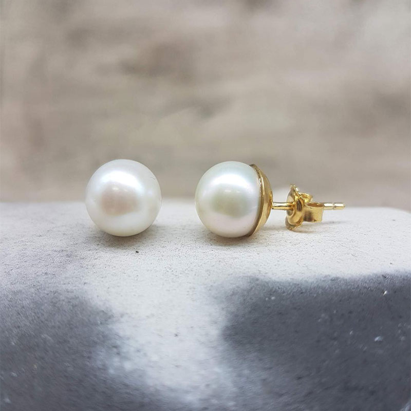 Womens handmade gold earrings K14 decorated with white natural pearls 9mm in round shape.