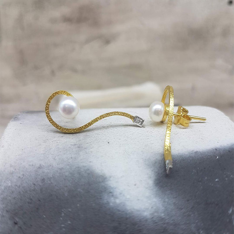 Womens handmade gold earrings K18 decorated with white natural pearls and white diamonds.