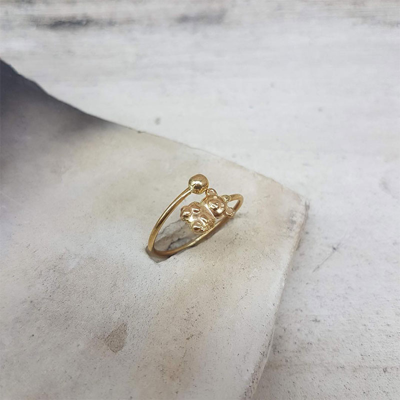 Childrens gold ring K14 in the shape of a teddy bear decorated with diamond surfaces.