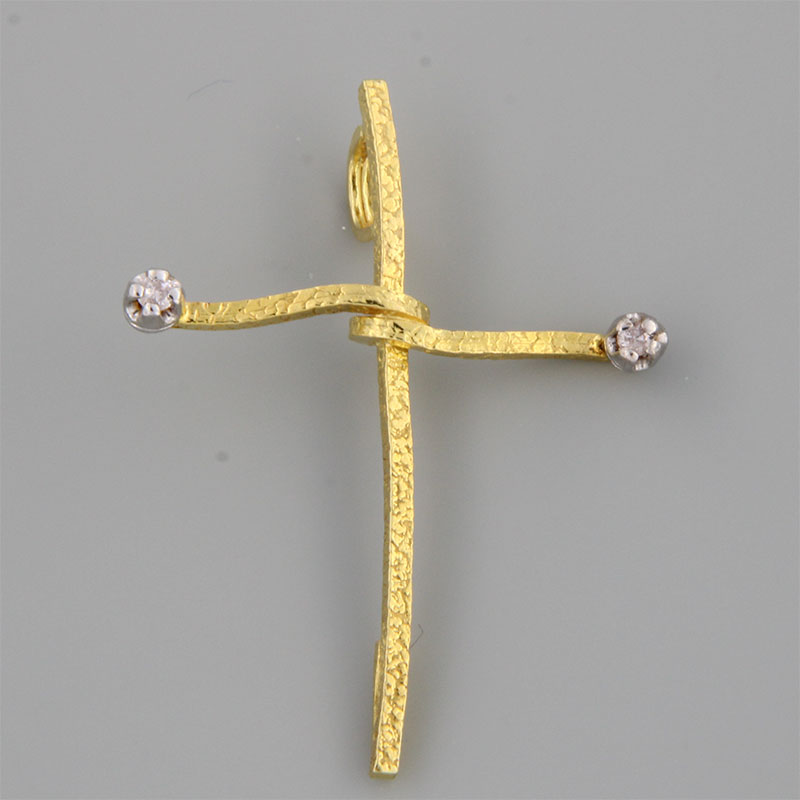 Womens handmade cross made of yellow gold K18 with special engraving processing white platinum and
  white Diamonds.