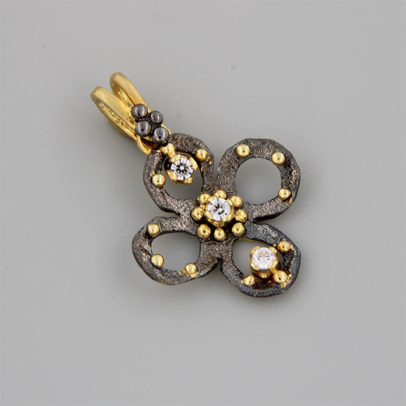 Womens handmade Cross made of yellow gold and black platinum K14 decorated with white zircons.