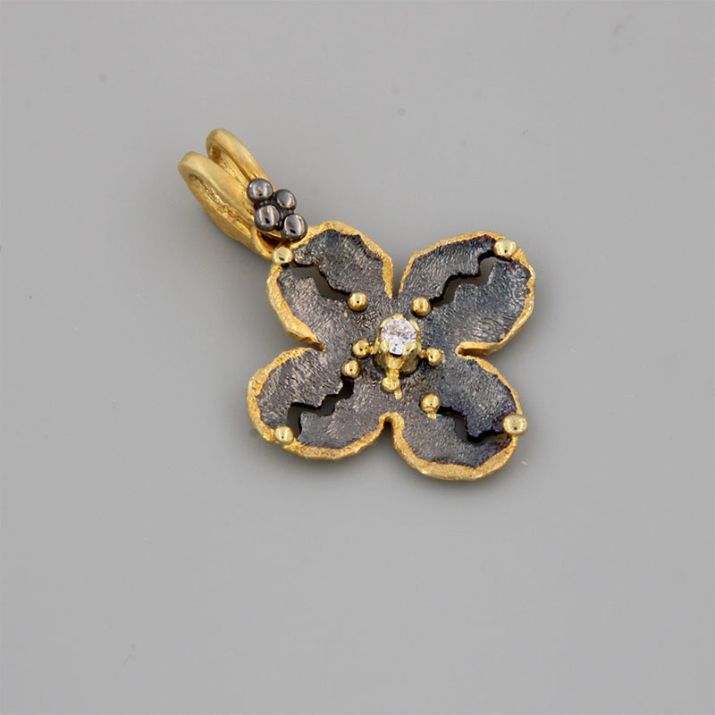 Womens handmade cross made of yellow gold and black platinum K14 decorated with white zircon.