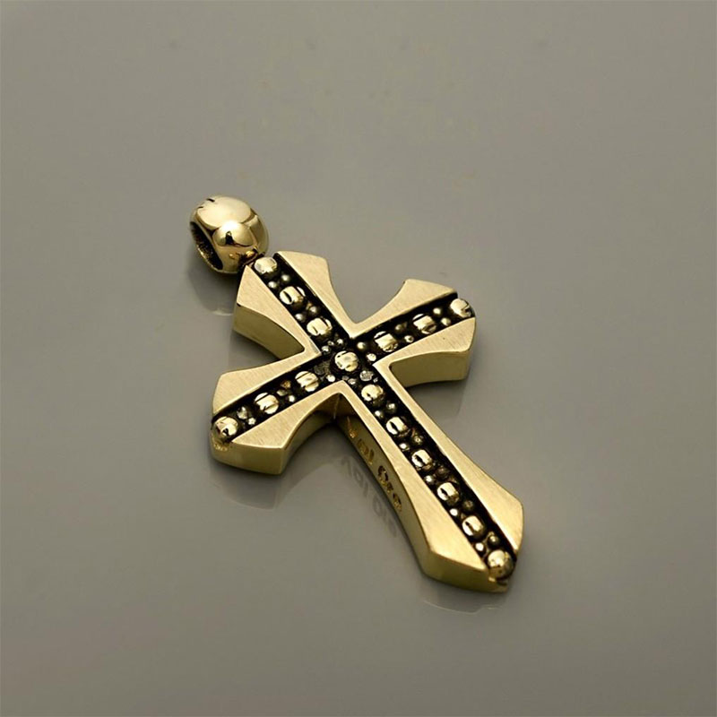 Childrens golden baptismal cross for Boy K14 with special treatment of black platinum from the Valoro workshop.