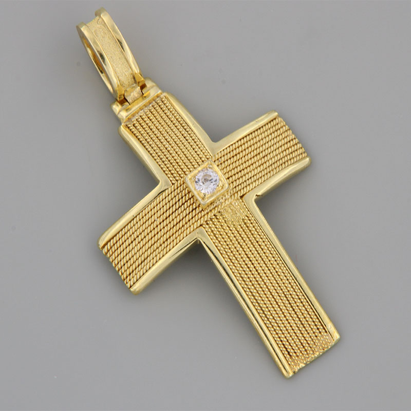Womens handmade cross made of yellow gold K14 with knitted wires decorated with white zircon.