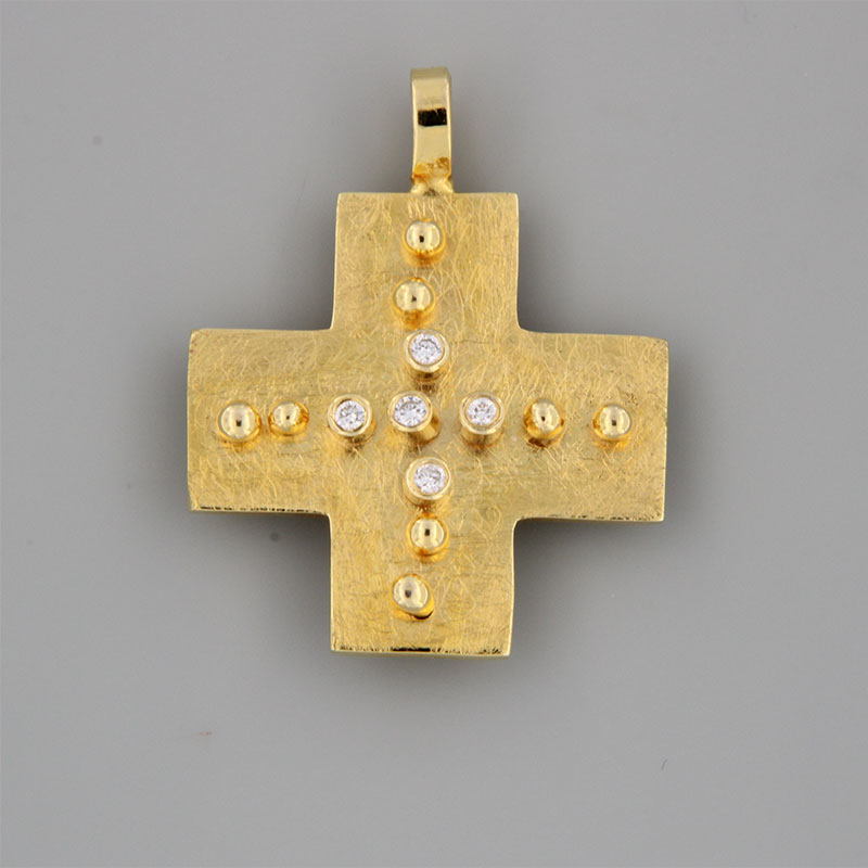 Womens handmade double-sided cross made of K14 gold with special engraving processing decorated with white Diamonds.