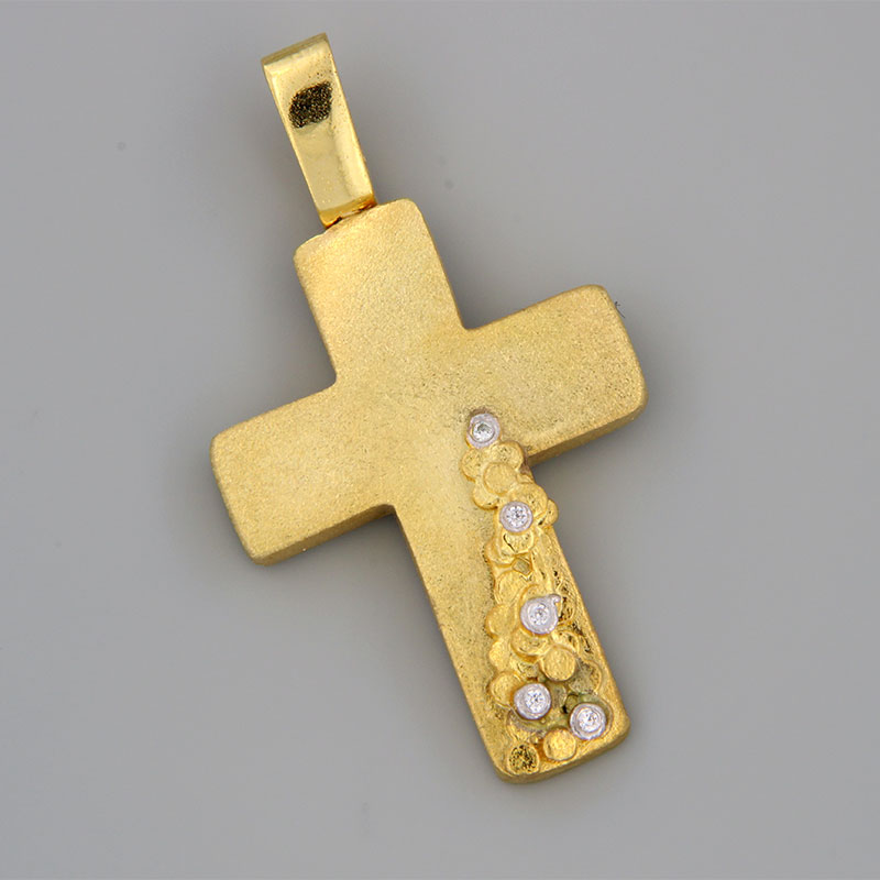 Womens handmade cross made of yellow gold K14 with special sandblasting treatment decorated with white zircons.