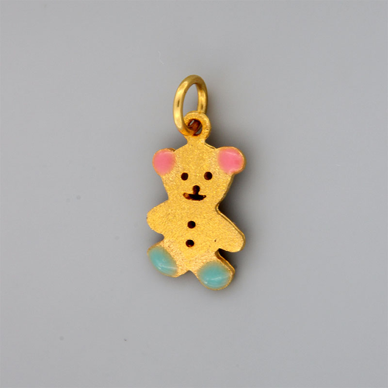 Childrens gold handmade teddy bear pendant with special sandblasting treatment and K14 enamel.