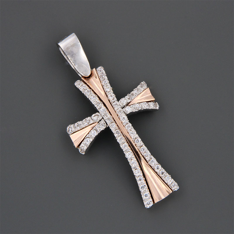 Handmade two-tone baptismal gold Cross K14 on a polished surface decorated with white zircons from the Valoro workshop.