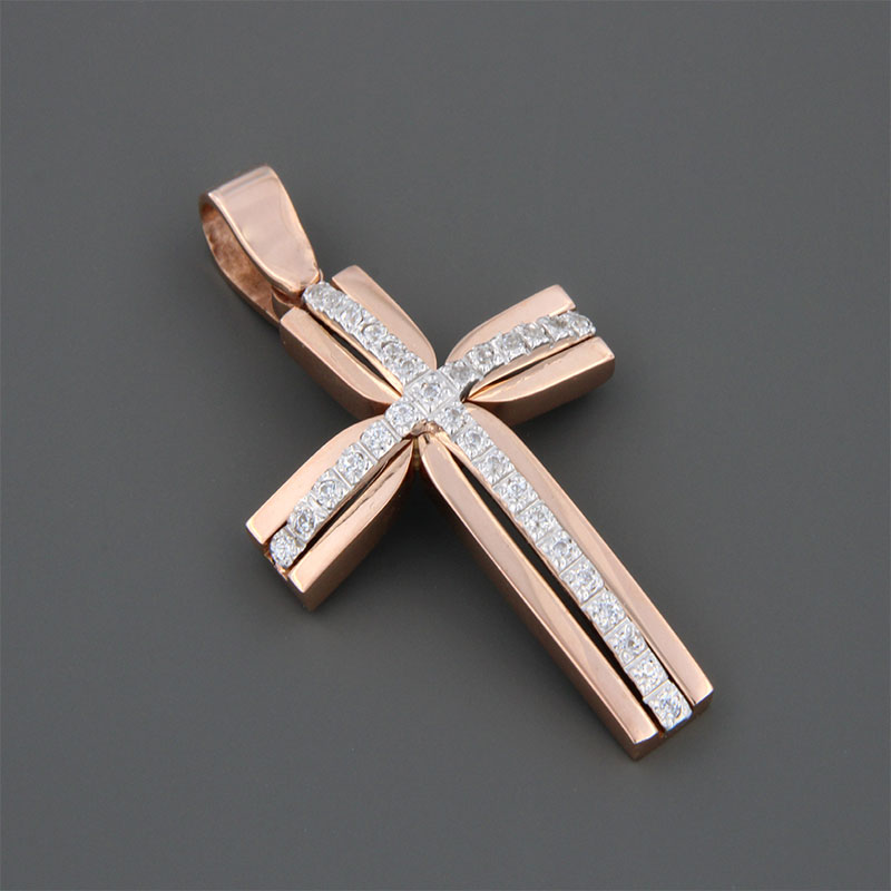 Childrens handmade two-tone baptismal gold Cross K14 on a polished surface decorated with white zircons from the Valoro workshop.