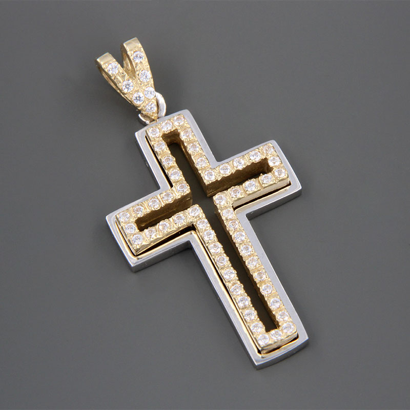 Handmade two-tone baptismal gold Cross K14 on a polished surface decorated with white zircons from the Valoro workshop.