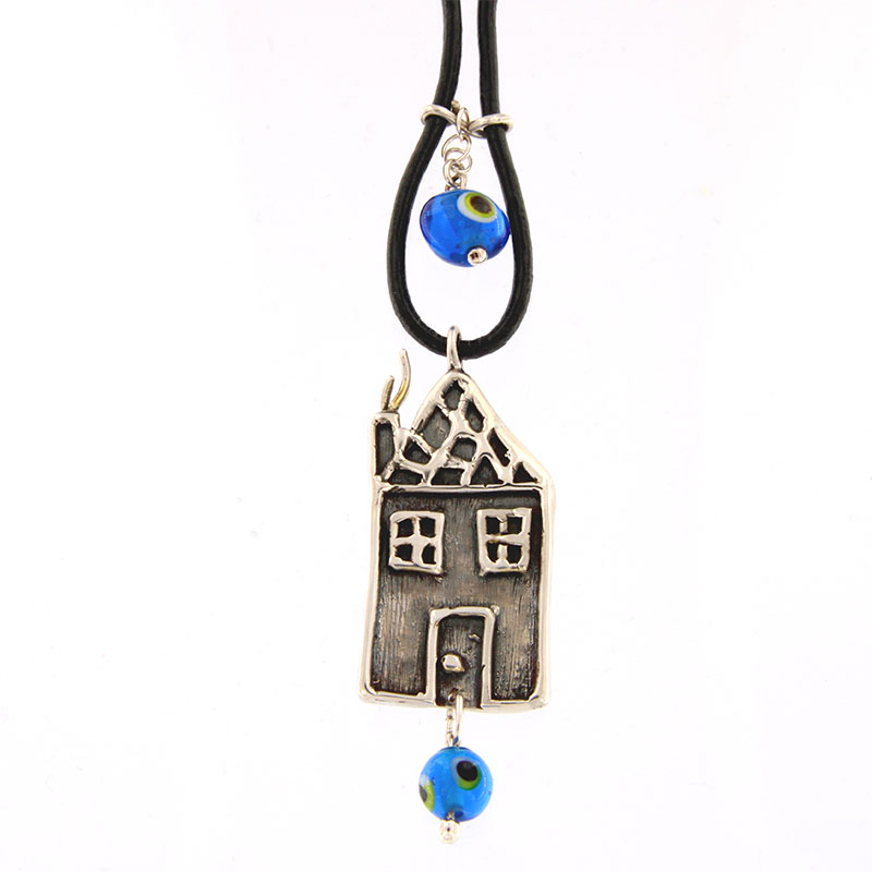 Two sided house charm made of Silver 925 with Mataki.