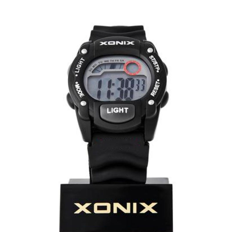 Xonix kids watch with digital dial and black rubber strap.