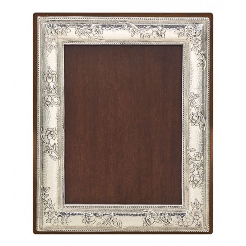 Forged frame with carved flowers made of silver 950° and brown wood 13X18.