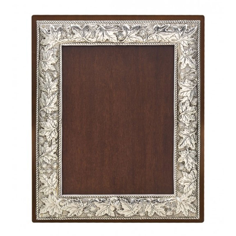 Frame with carved plantain leaves made of silver 950° and brown wood 10x15.