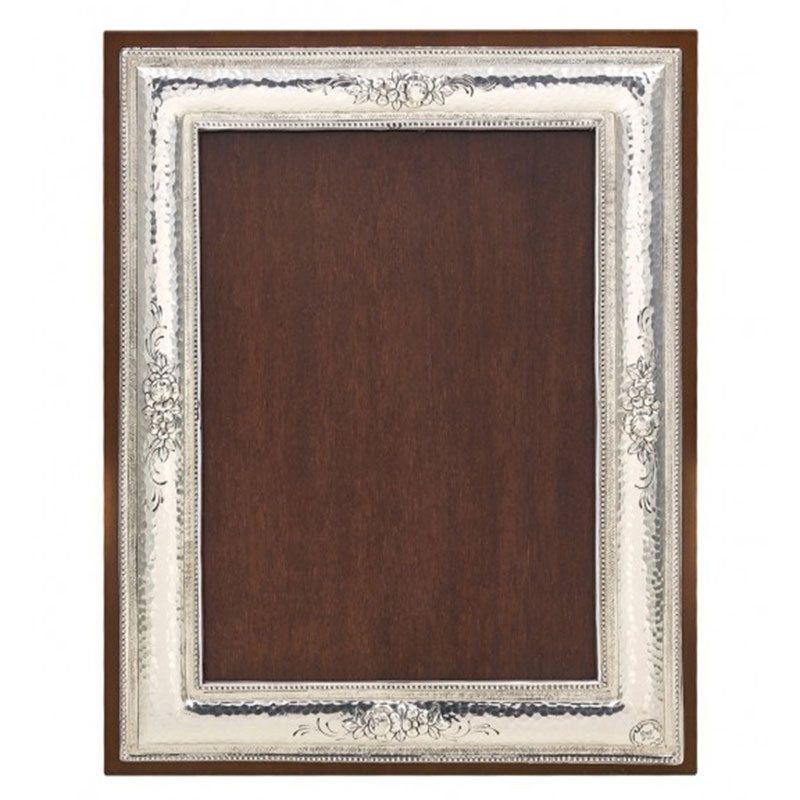 Forged frame with carved flowers made of 950° silver and brown wood 9X13.