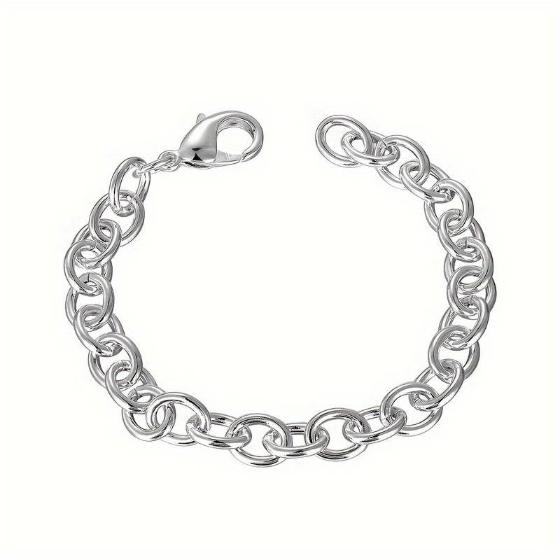 Womens silver bracelet 925° with solid oval hoops and safety clasp.