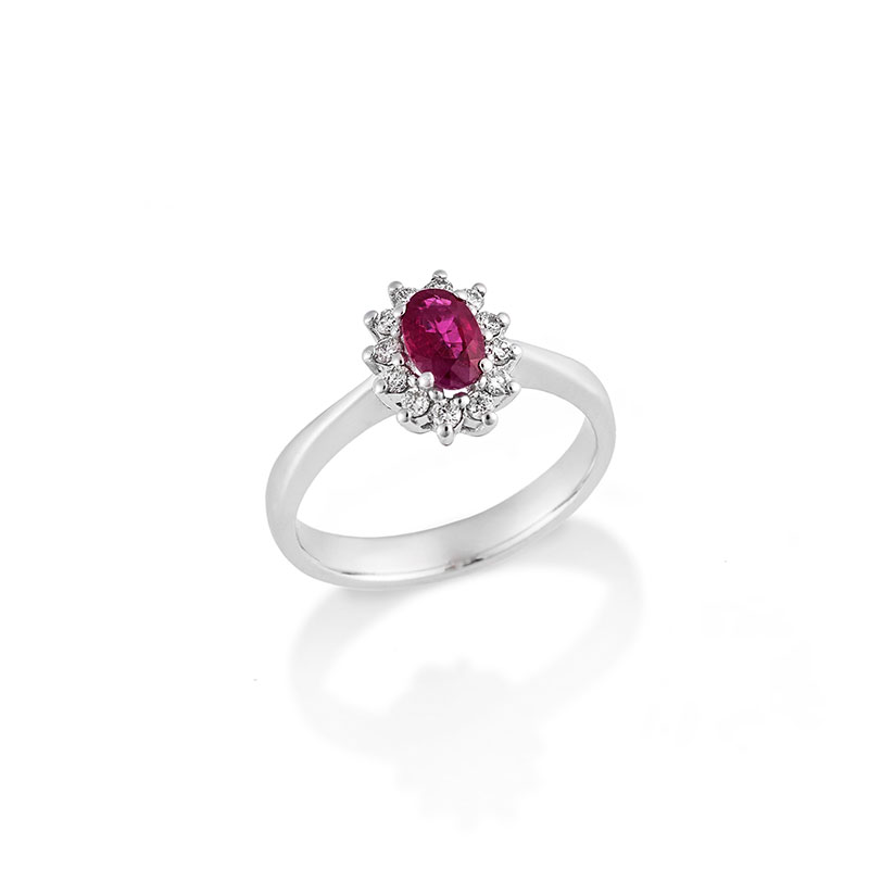Womens 18K white gold rosette ring decorated with rubies and brilliants.