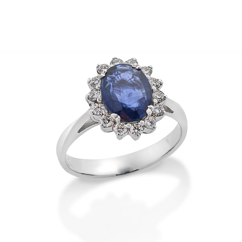 Womens 18K white gold rosette ring decorated with sapphire and briquettes.